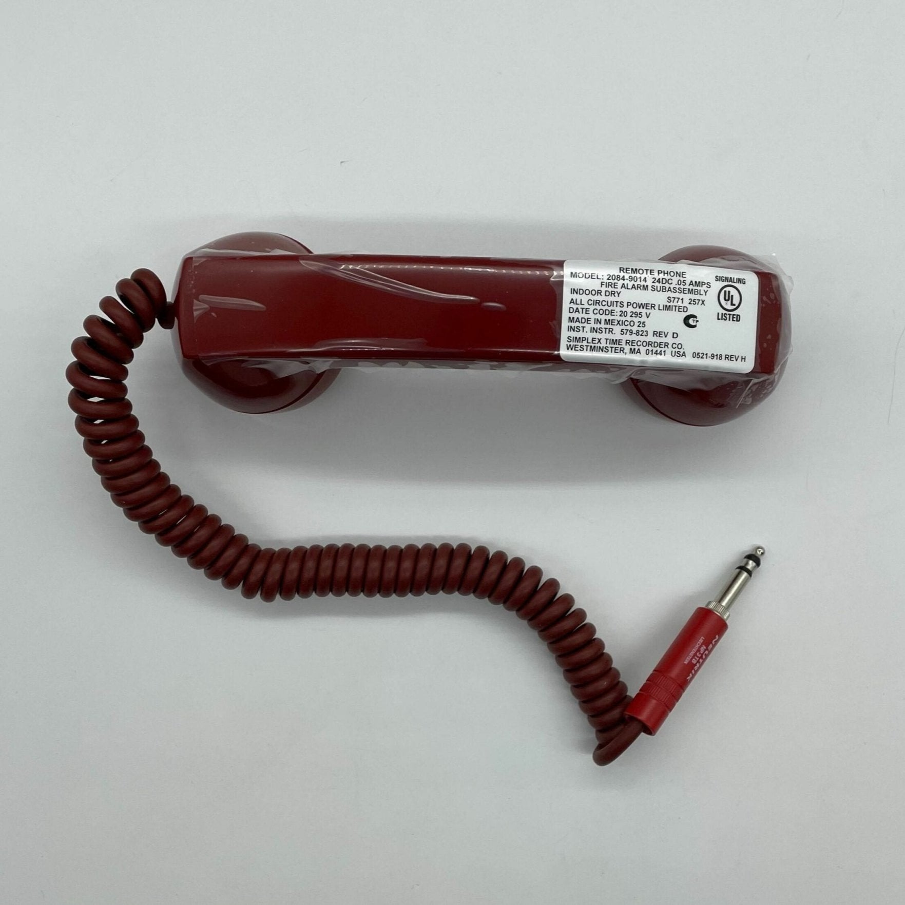 Simplex 2084-9014 fire alarm sensor with ULC certification, mounted on ceiling, part of Simplex fire alarm system.