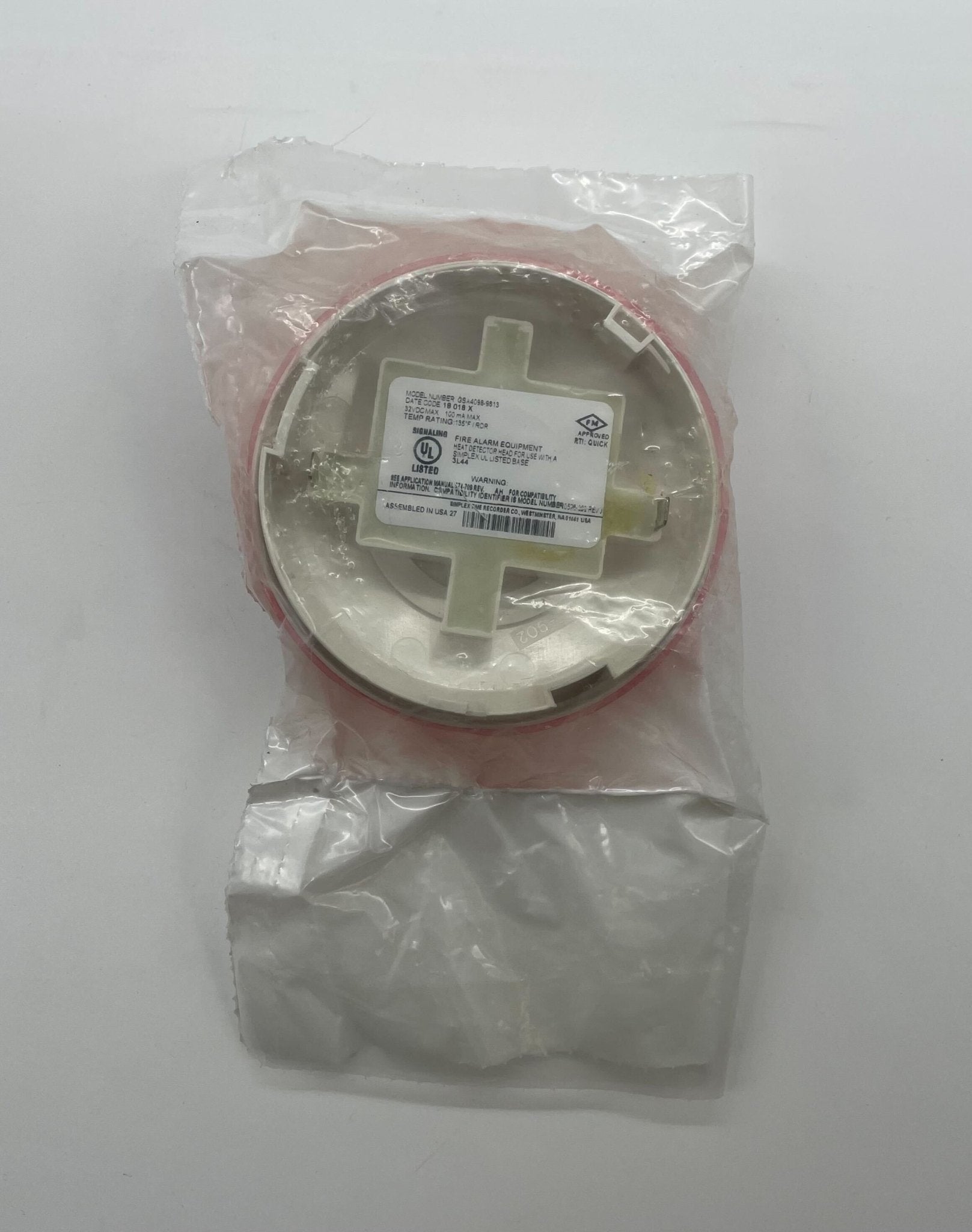 Simplex GSA4098-9613 heat detector mounted on ceiling, part of fire safety system by Simplex, in a commercial building setting