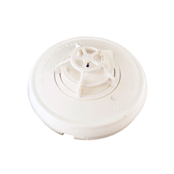 Simplex 4098-9733 heat detector, mounted on a ceiling, with a white plastic housing, designed for fire safety systems.