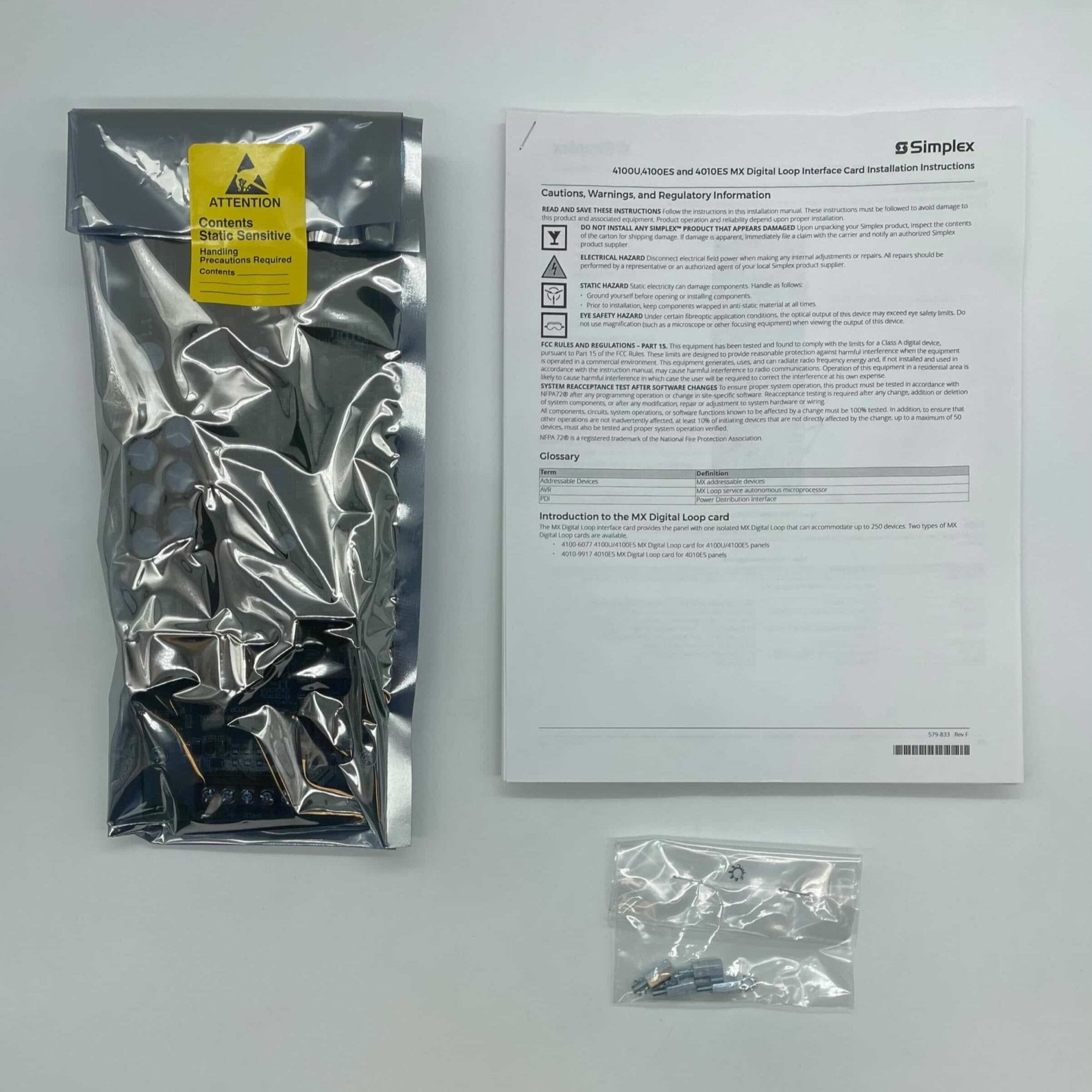 Simplex 4100-6077 modules, industrial control components, with visible circuit connections and brand markings.