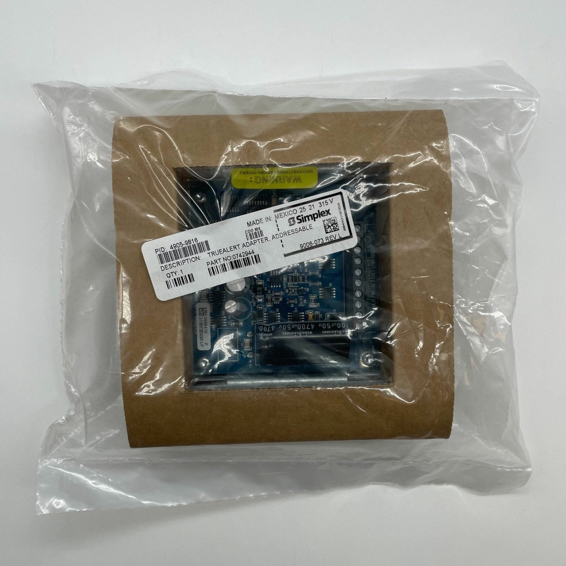 Simplex 4905-9816 fire alarm sensor showing a compact, white detection device with wiring connections, part of the fire alarm system.