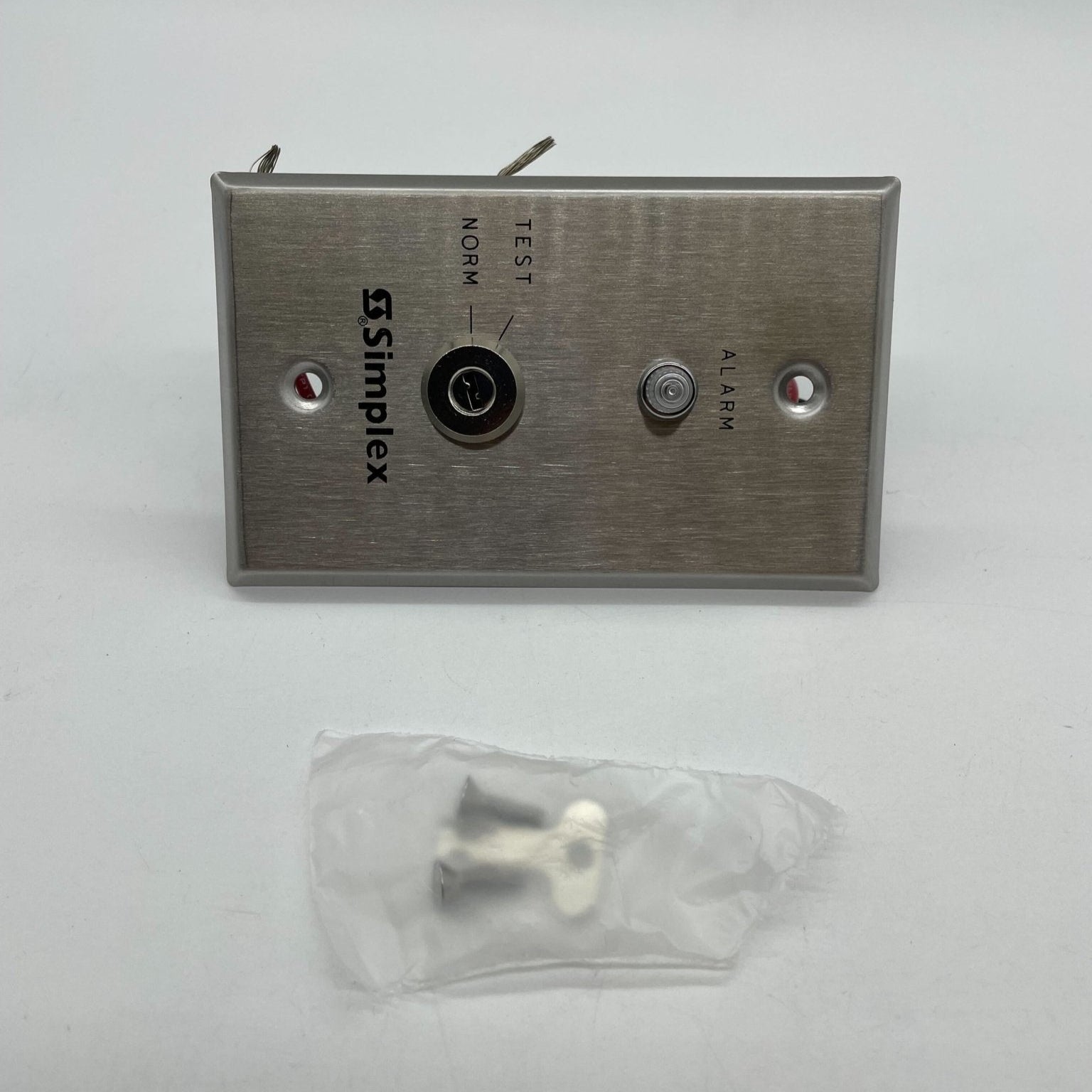 Simplex 4098-9834 fire alarm system with alarm sensor and wiring, designed for fire safety in commercial or industrial buildings.