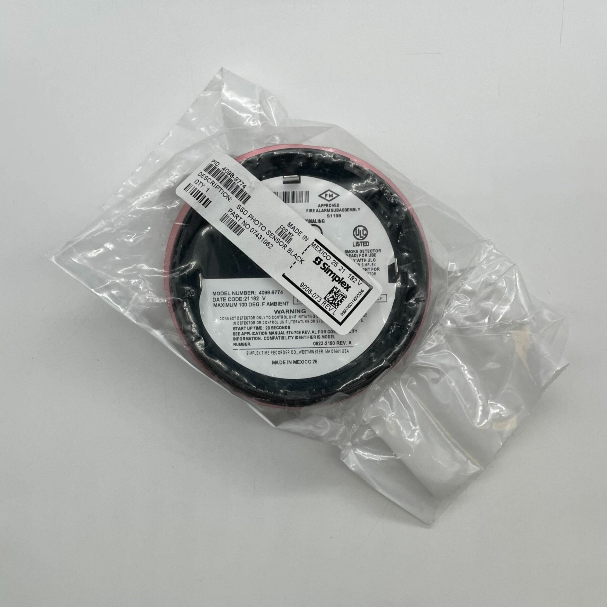 Simplex 4098-9774 smoke detector with alarm sensor and mounting bracket, designed for fire safety and detection.