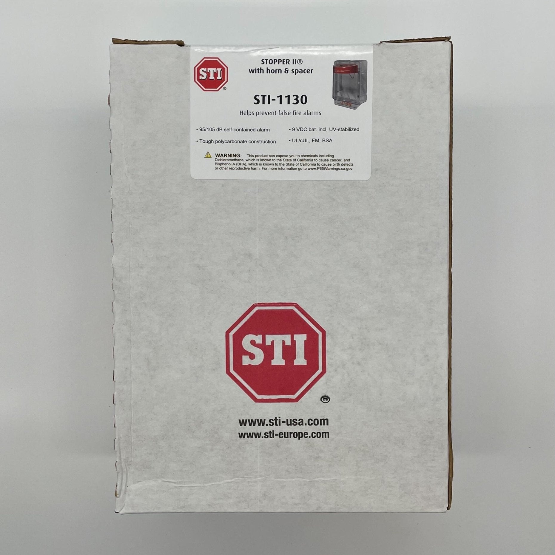 STI Stopper II with horn and clear spacer, a durable brass musical instrument stopper with ergonomic design.