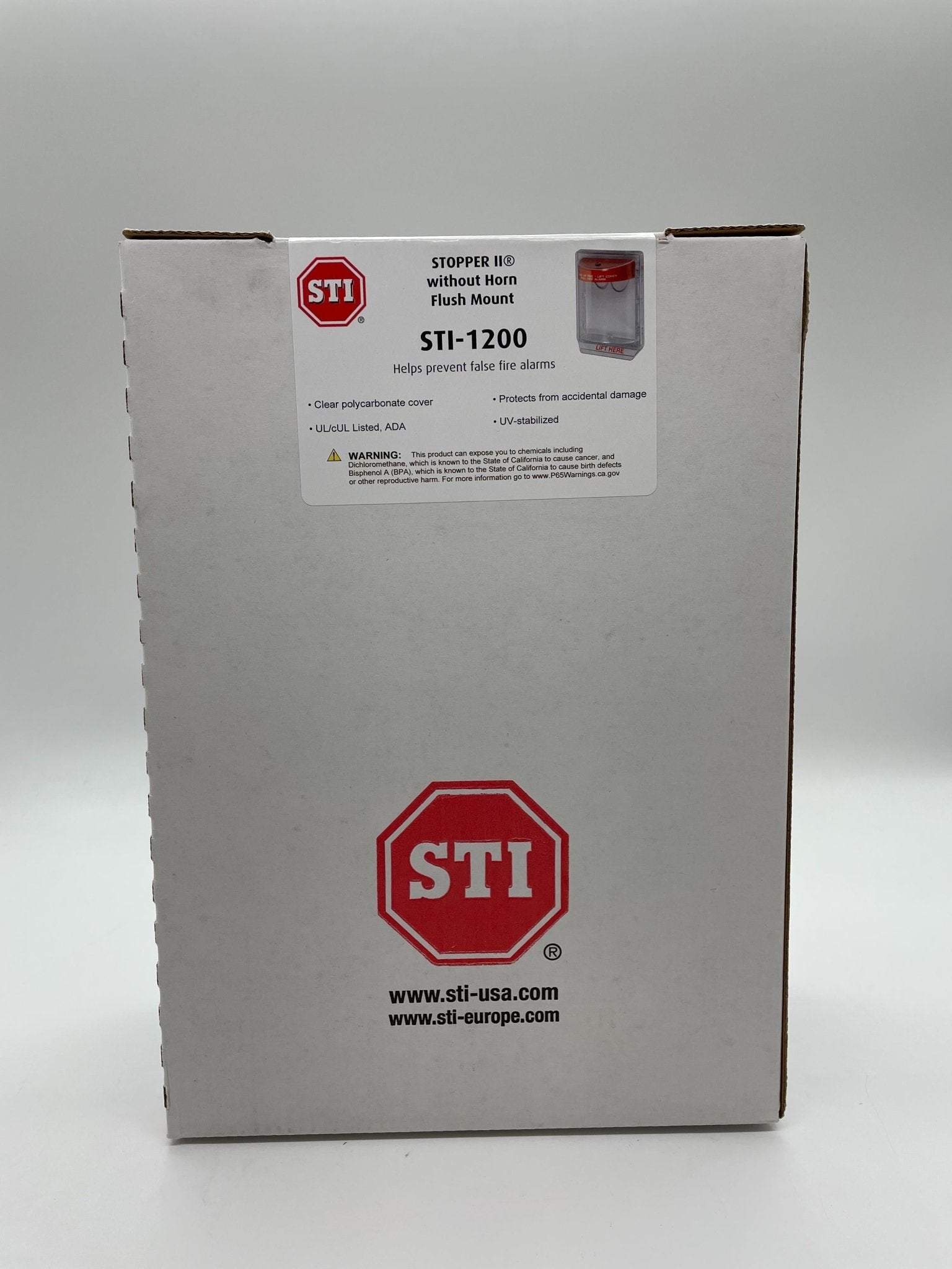 STI Stopper II fire-rated flush mount stopper without horn, model STI-1200, installed on a system, with fire label visible