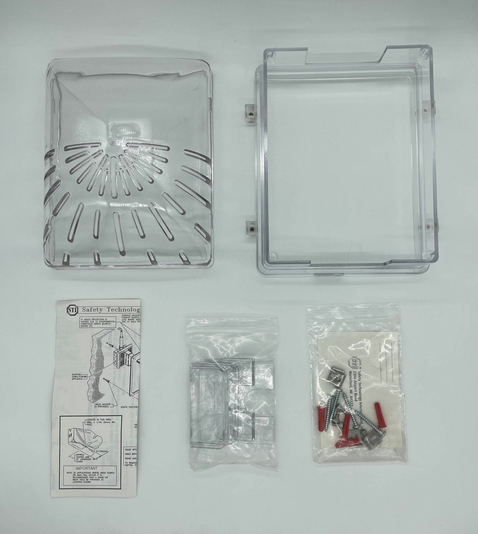 STI-1210D Horn Strobe Damage Stopper with enclosed back box, mounted on a wall for fire alarm safety and protection.