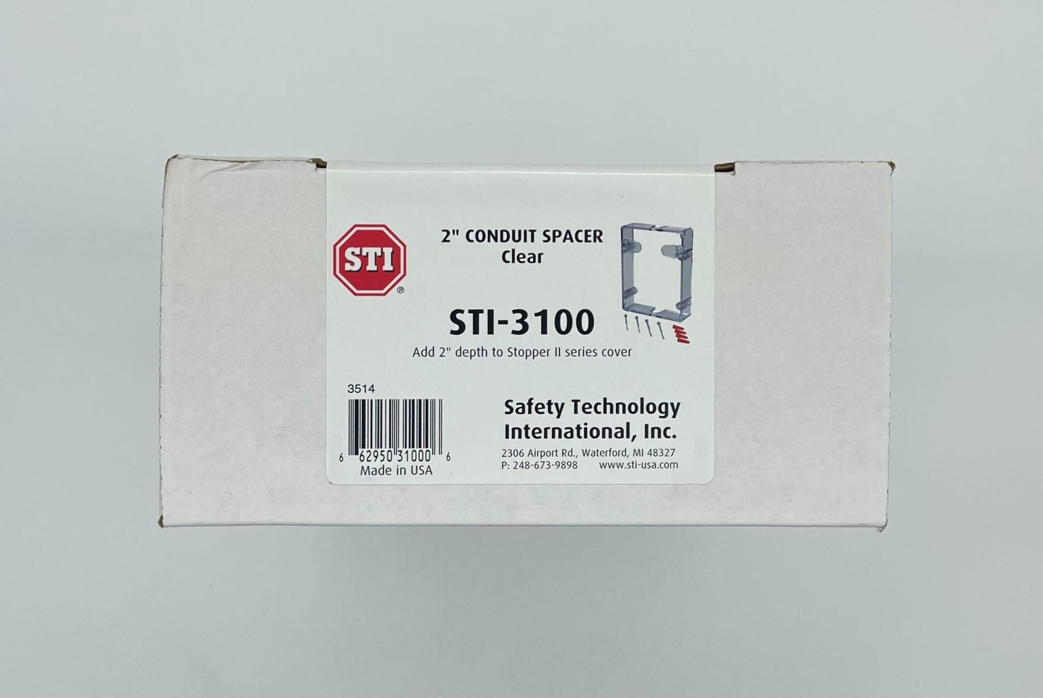 Clear STI-3100 Conduit Spacer for fire alarm systems, used to secure conduit in fire alarm installations.
