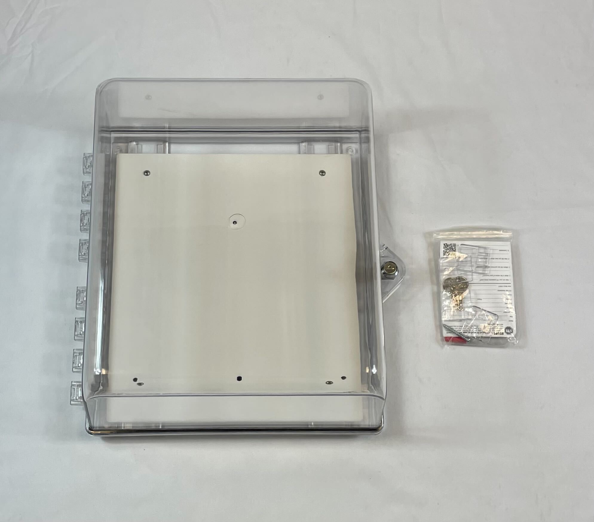 Polycarbonate protective cabinet with backplate and stoppers by STI, designed for secure storage and safety applications.