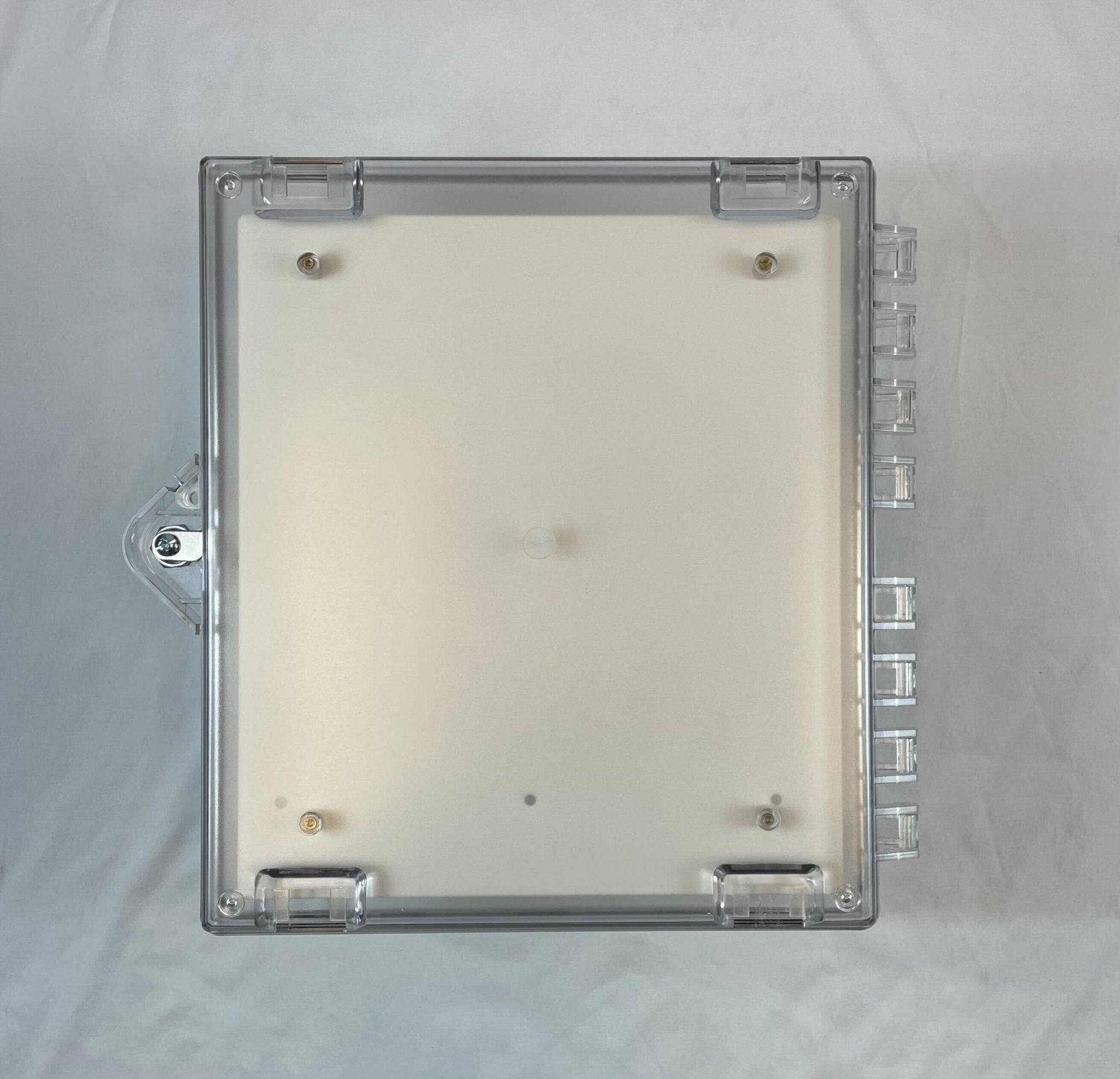 Polycarbonate protective cabinet with backplate by STI, designed for stoppers, shown in a sturdy, transparent protective enclosure.