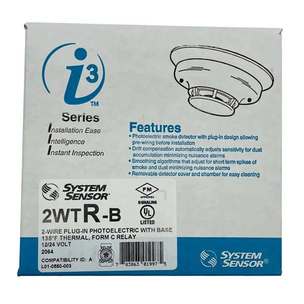 System Sensor 2WTR-B smoke detector with alarm and wiring connections, mounted on a ceiling for fire safety.
