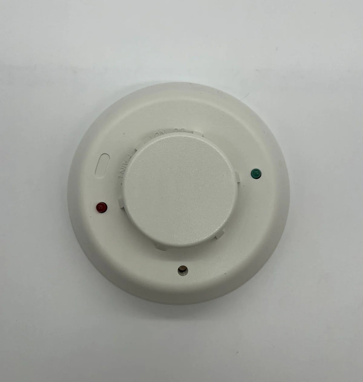 System Sensor 2WTR-B fire alarm switch with two-wire connection and manual test feature, mounted on a wall.