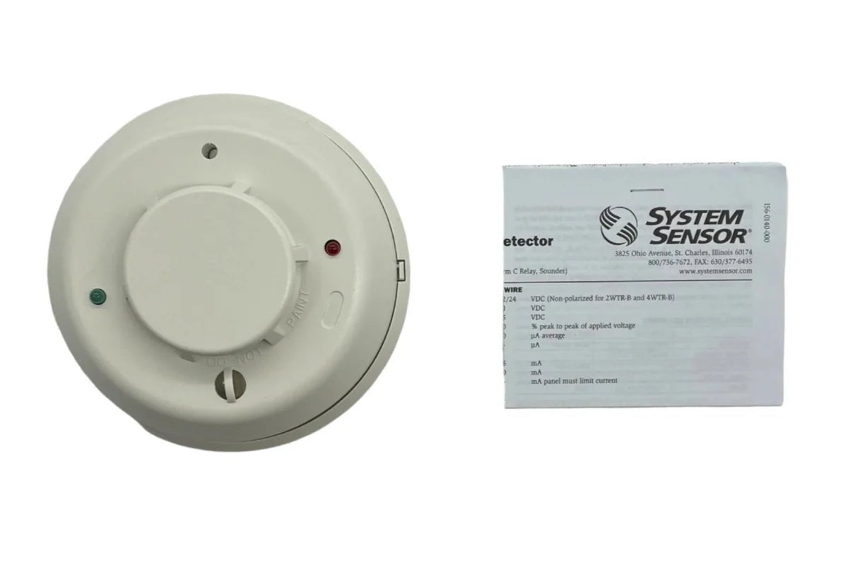 System Sensor 4WTA-B fire alarm detector with dual heat sensors and white plastic housing, mounted on a ceiling.