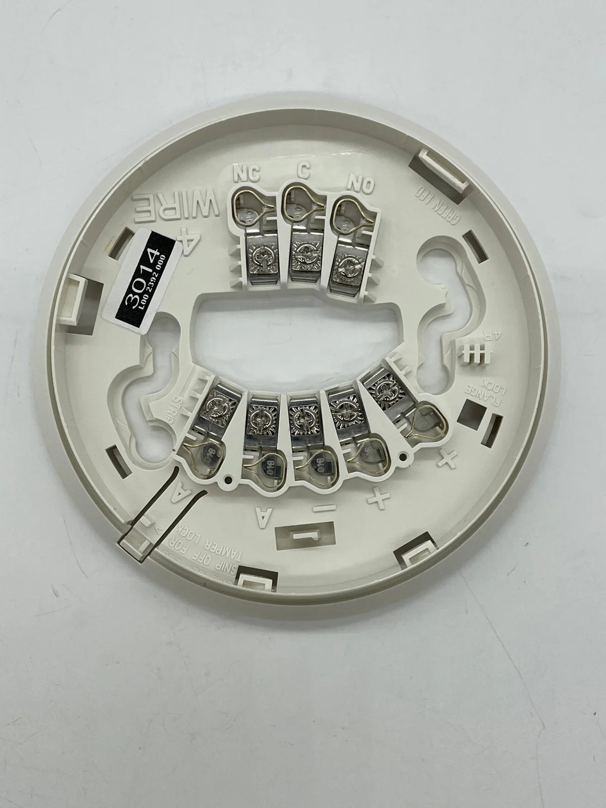 System Sensor 4WTAR-B wireless temperature sensor with digital display and mounting bracket for HVAC applications.
