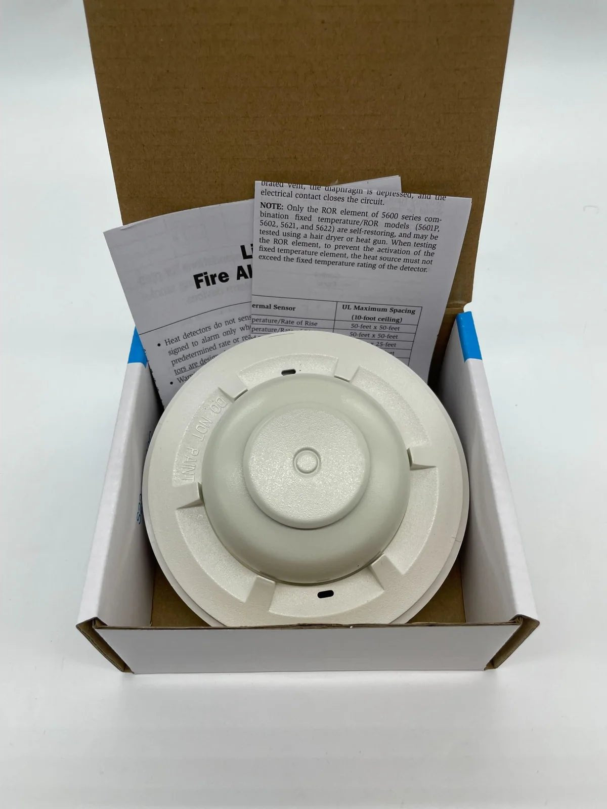 System Sensor 5601P smoke detector with Jem Systems Canada label, featuring a round white sensor with mounting base