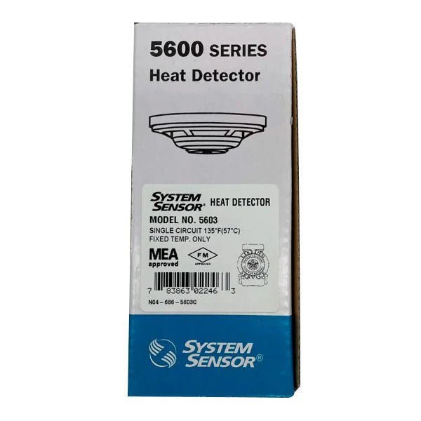 System Sensor 5603 smoke detector mounted on ceiling, white fire alarm device for residential or commercial safety systems