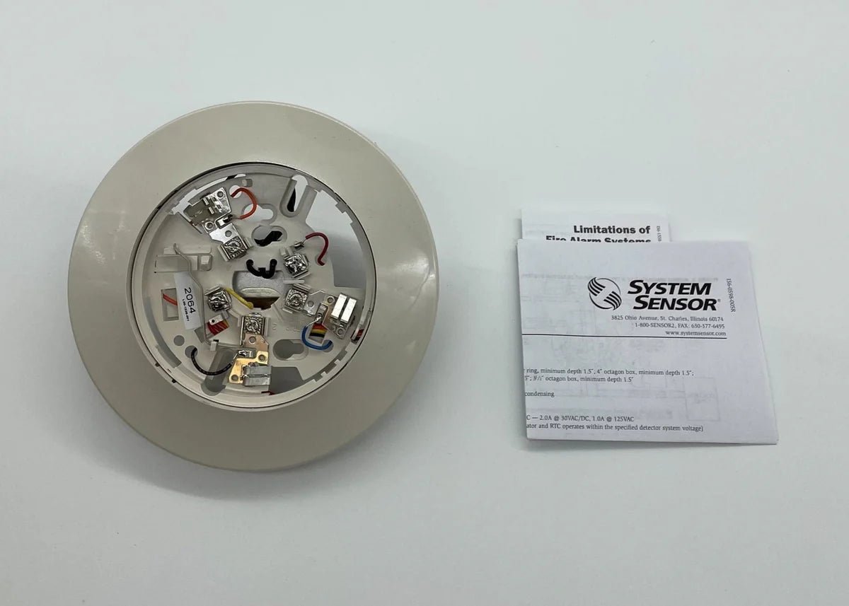 System Sensor B114LP smoke detector with alarm and mounting base, designed for fire safety and alarm systems.