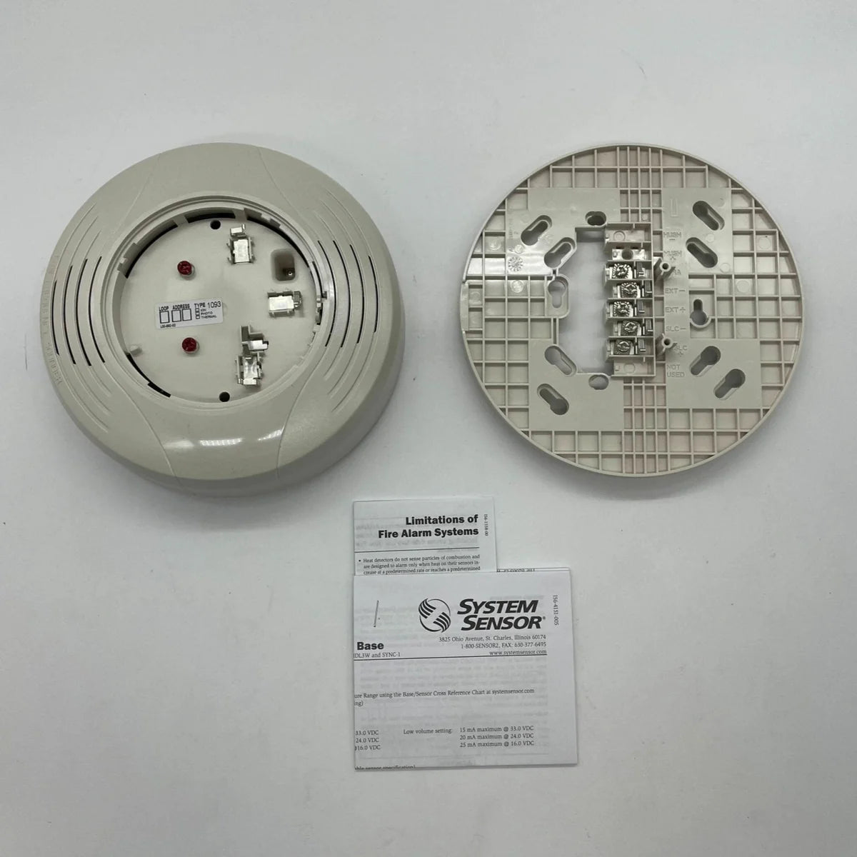 System Sensor B200S-LF-IV fire alarm detector mounted on ceiling in a building interior.