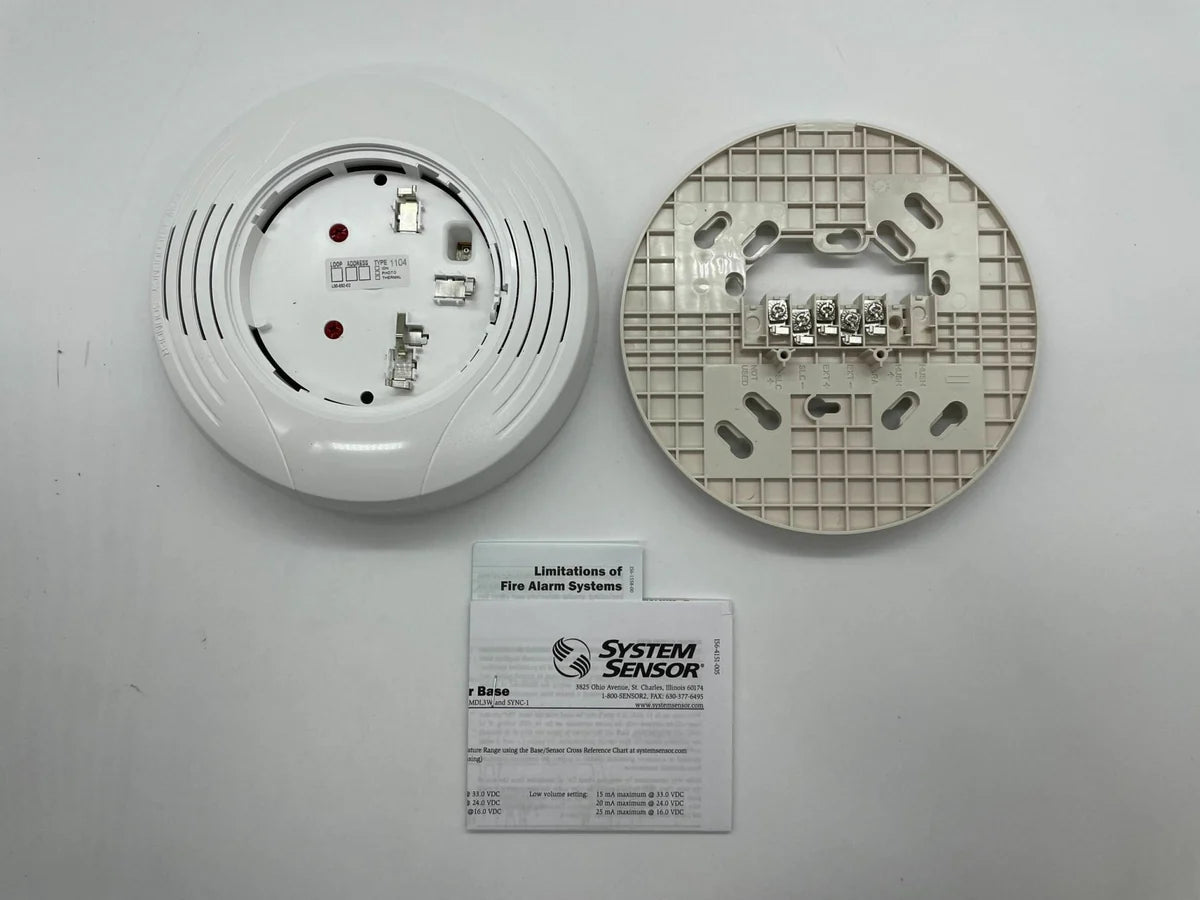 System Sensor B200S-LF-WH smoke detector with long-life white casing, mounted on ceiling for fire safety detection.
