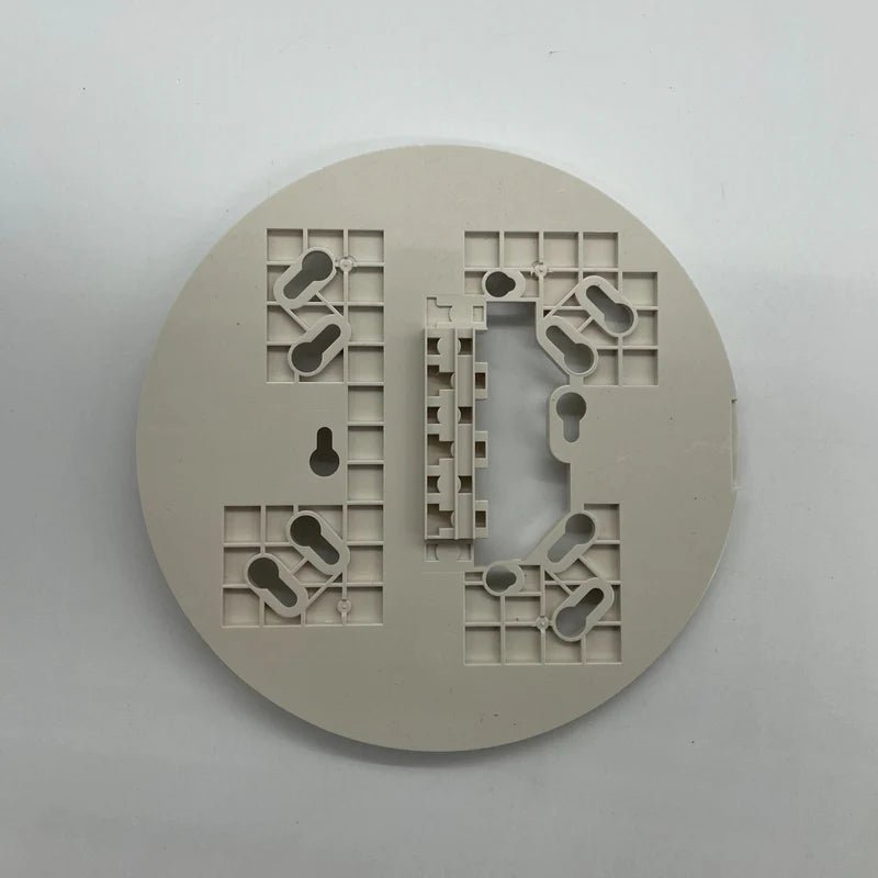 System Sensor B224BI-WH white dual-technology smoke detector with alarm testing button, mounted on ceiling.