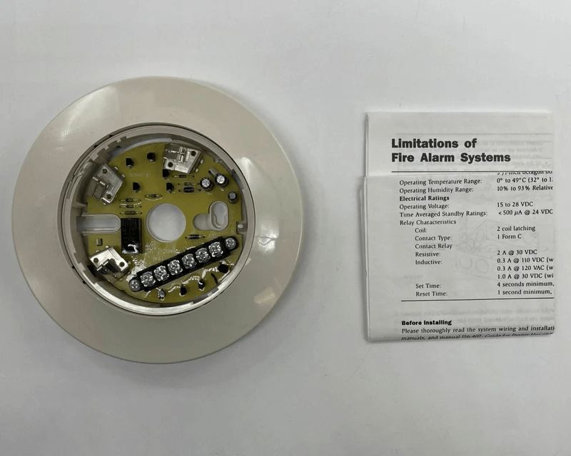 System Sensor B224RB fire alarm detector with red cover and mounting base, designed for fire and smoke detection.
