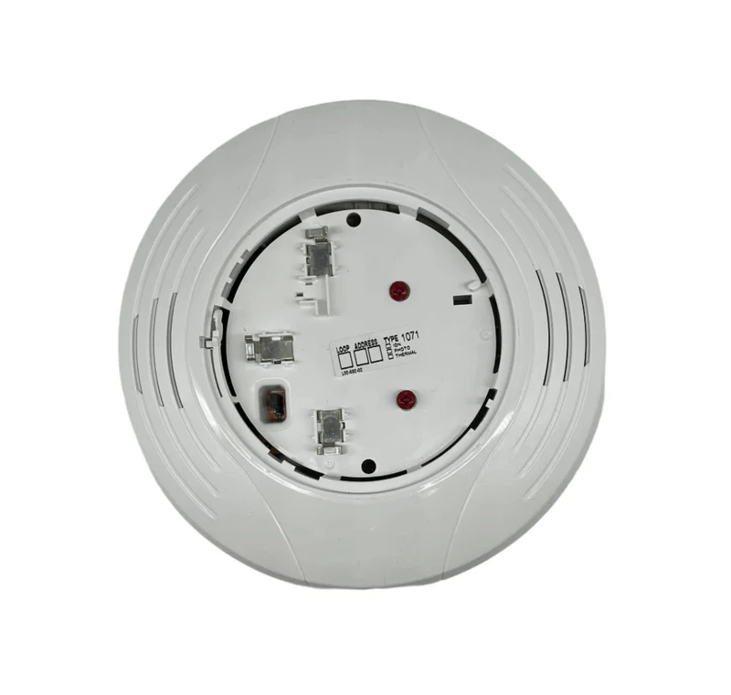 System Sensor B224RB-WH smoke detector with red LED indicator mounted on white ceiling tile.