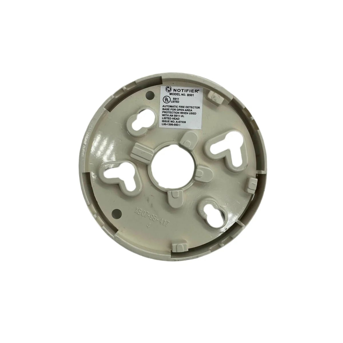 System Sensor B501 fire alarm sensor mounted on wall, showing its compact design and detection components for safety systems.