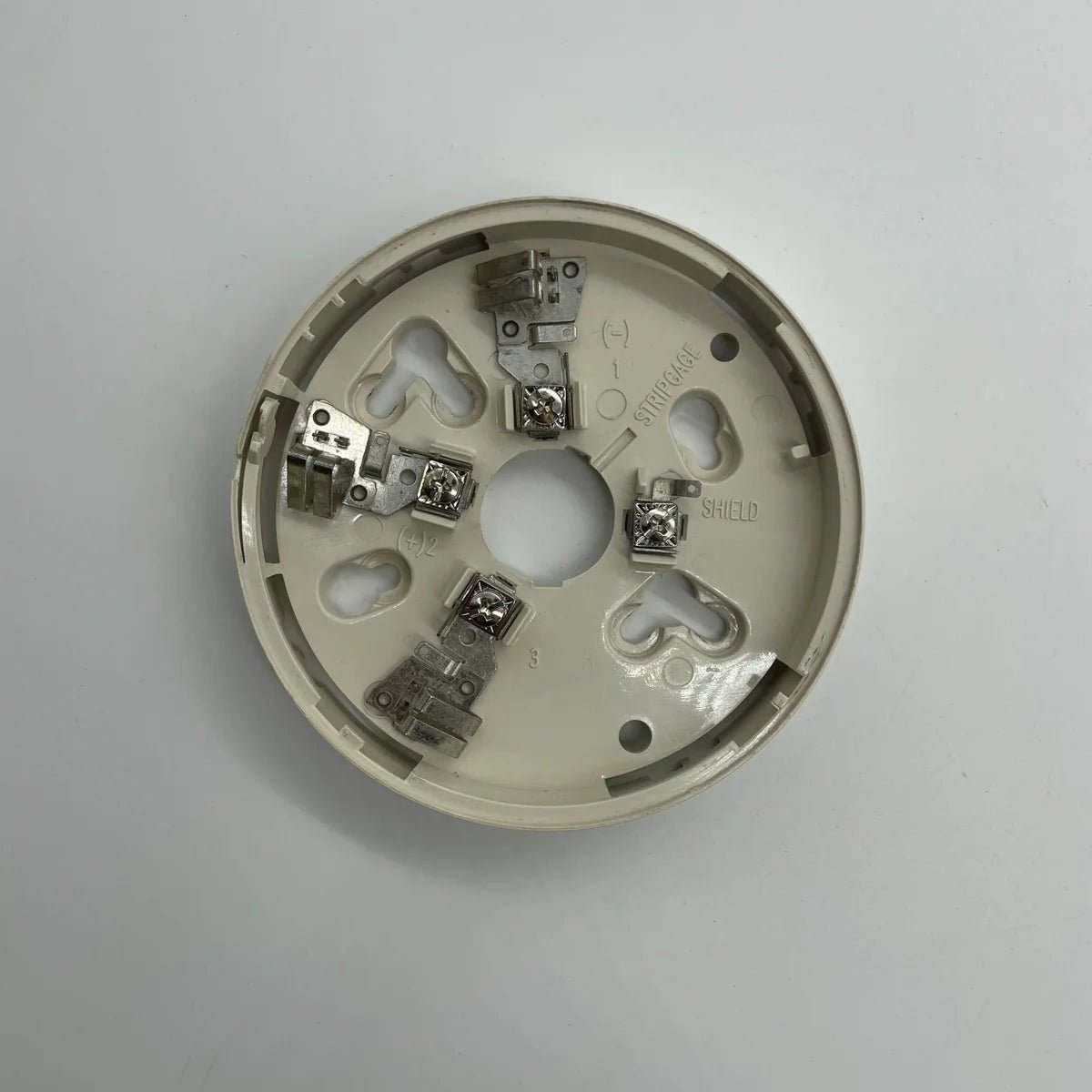 System Sensor B501 fire alarm detector with LED indicator, mounted on ceiling for safety and early smoke detection.