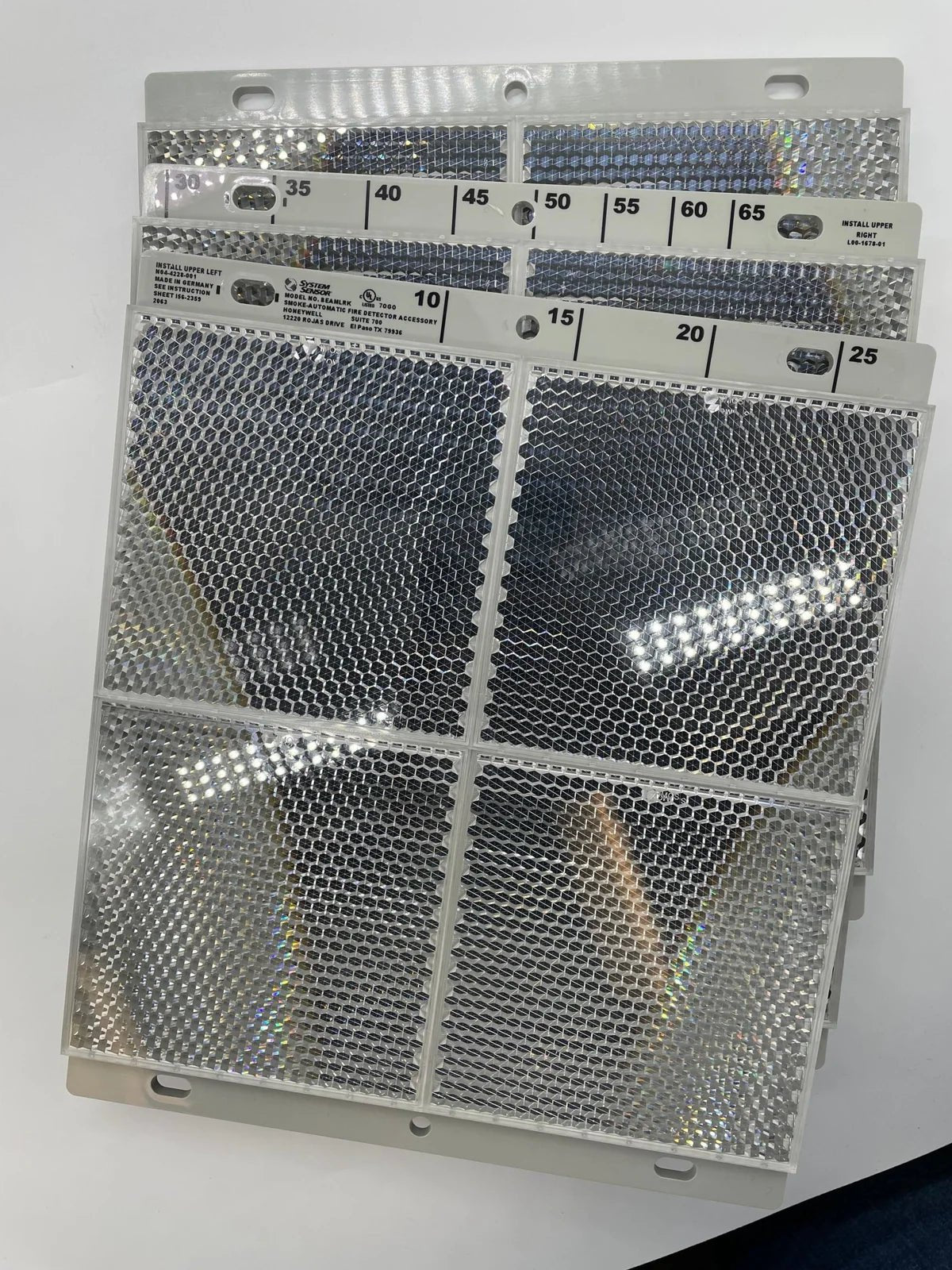 System Sensor BEAMLRK ULC fire detection sensor mounted on ceiling in an industrial setting