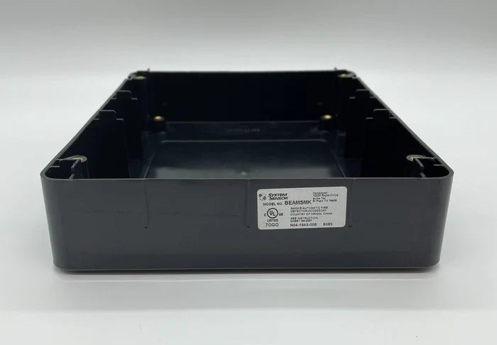 System Sensor BEAMSMK beam smoke detector mounted on ceiling, designed for fire detection and safety in commercial spaces.