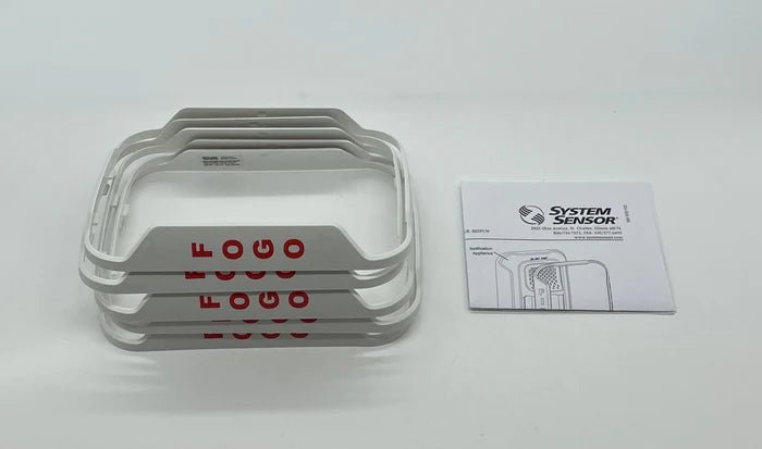 System Sensor BZSPW-PG fire alarm sensor with red indicator light mounted on a wall in a building safety system