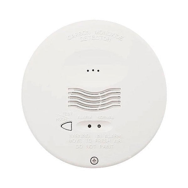 System Sensor CO1224TR carbon monoxide detector mounted on wall, with digital display and sensor components visible.
