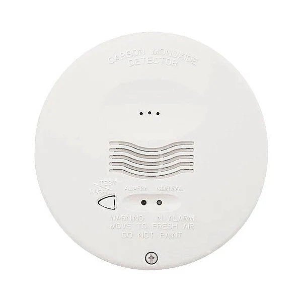 System Sensor CO1224TR carbon monoxide detector mounted on wall, with digital display and sensor components visible.