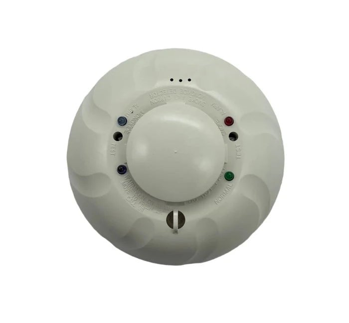 System Sensor COSMO-4W wireless smoke detector with alarm and sensor components, designed for fire safety systems.