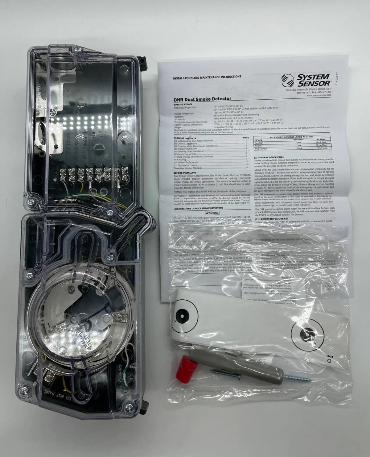 System Sensor DNR fire alarm detector mounted on ceiling, with wiring and mounting plate visible.