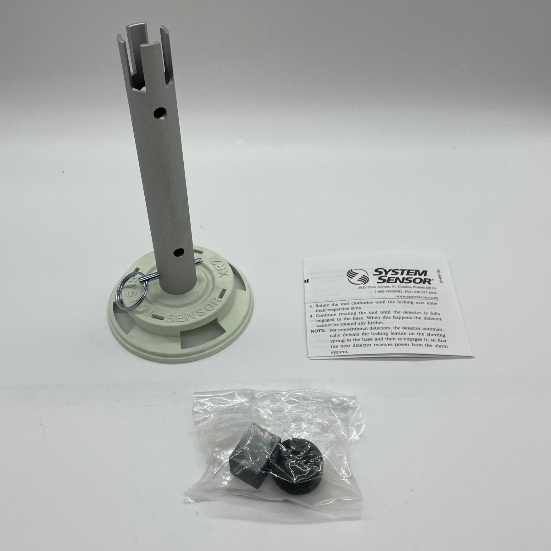 System Sensor XR2 fire alarm sensor with wiring and mounting components for building safety and fire detection systems.