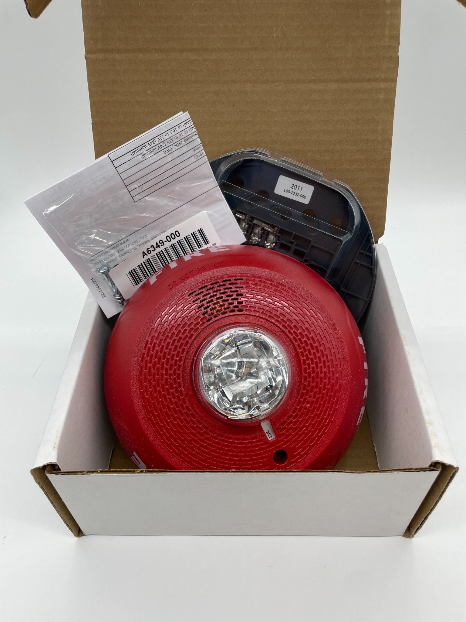 System Sensor PC2RL fire alarm detector with Jem Systems Canada label, mounted on a ceiling, showing its sensor and wiring.