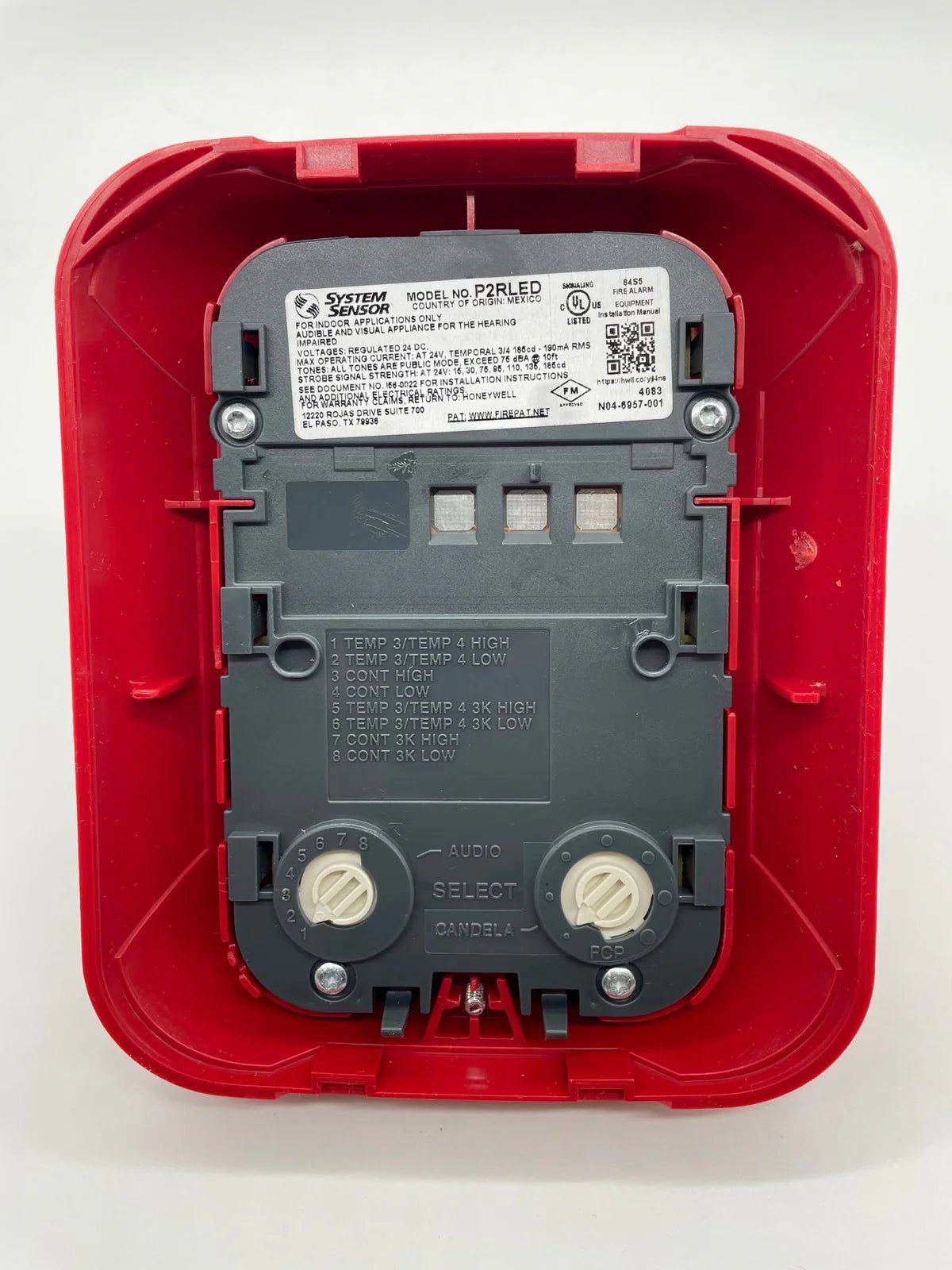 System Sensor P2RLED emergency exit sign with red LED illumination, mounted on a white background.