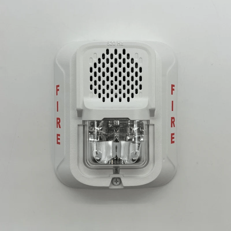 System Sensor P2WL-LF smoke detector with lithium battery and alarm indicator, mounted on ceiling surface for fire safety.