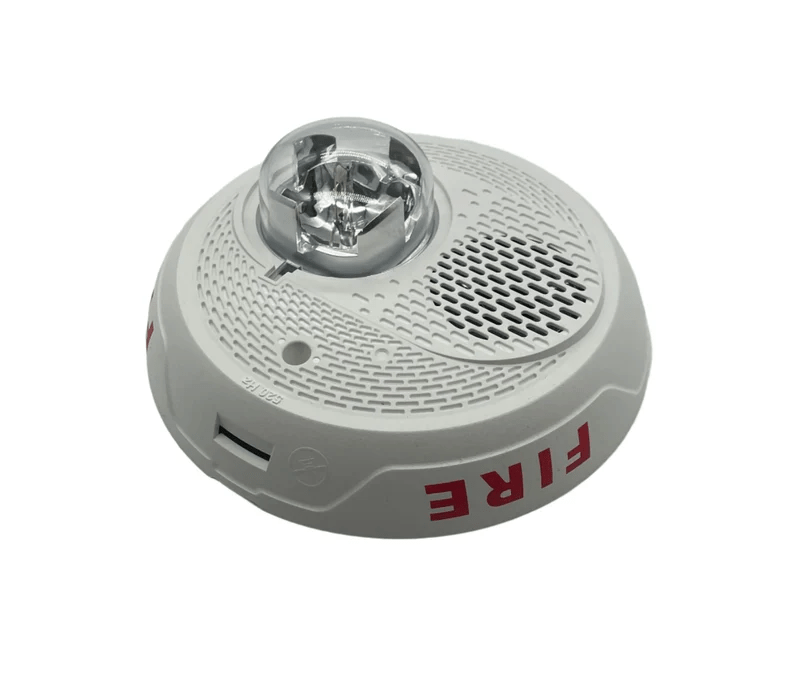 System Sensor PC2WL-LF wireless smoke detector with LED indicator and mounting bracket, designed for fire safety applications.