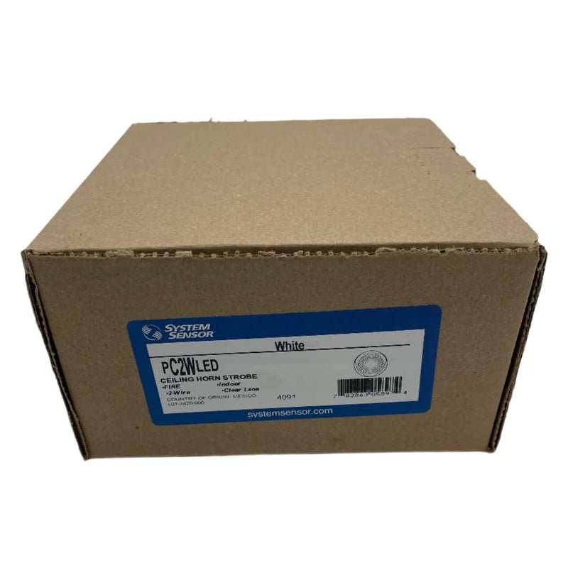 System Sensor PC2WLED emergency LED exit sign with white background and clear directional arrow for safety signage.