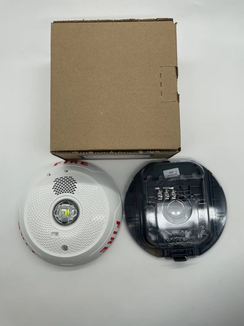 System Sensor PC2WLED LED wall-mounted emergency lighting fixture with adjustable arm and clear lens.