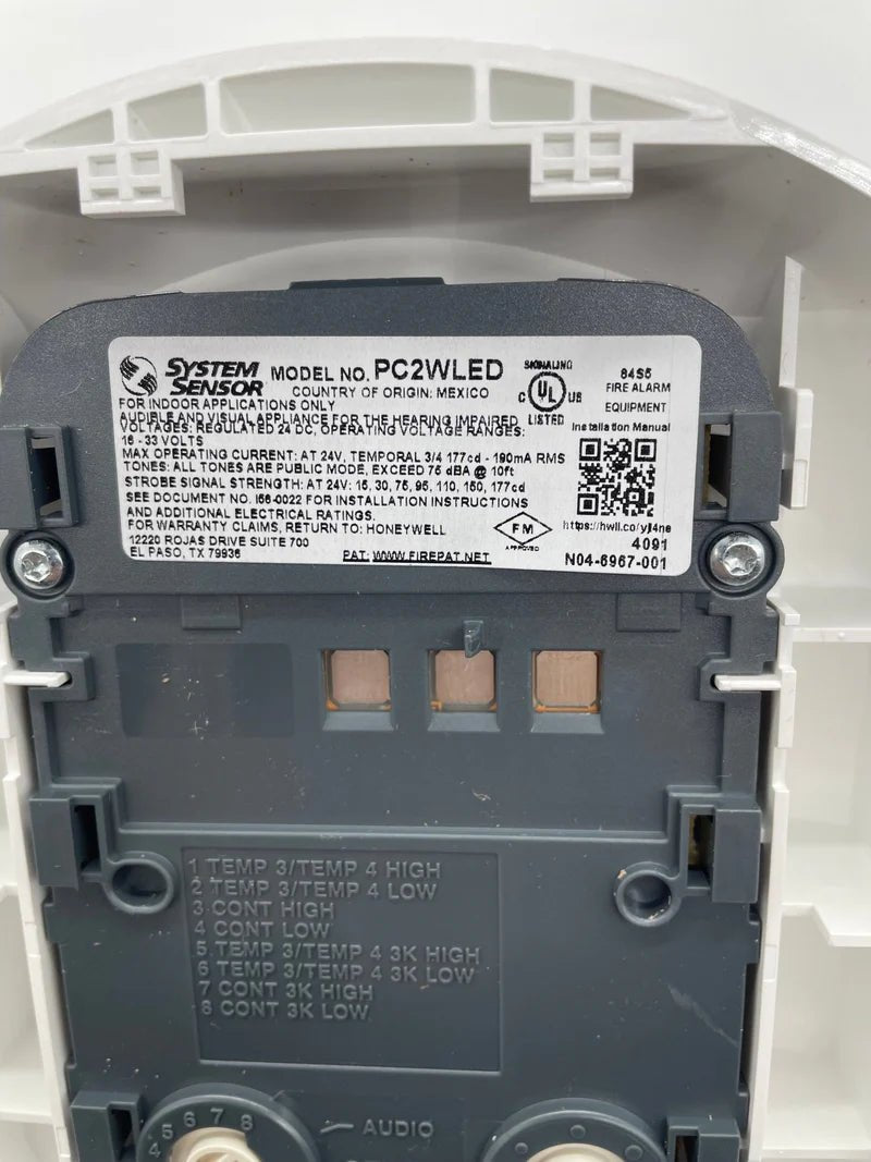 System Sensor PC2WLED LED Wall Mount Emergency Light with white finish and mounting bracket for safety illumination.