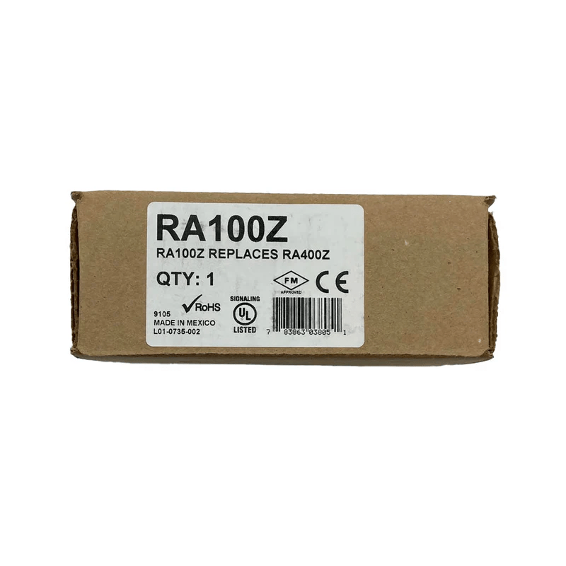 System Sensor RA100Z fire alarm smoke detector with white casing and mounting bracket, close-up view of the device.