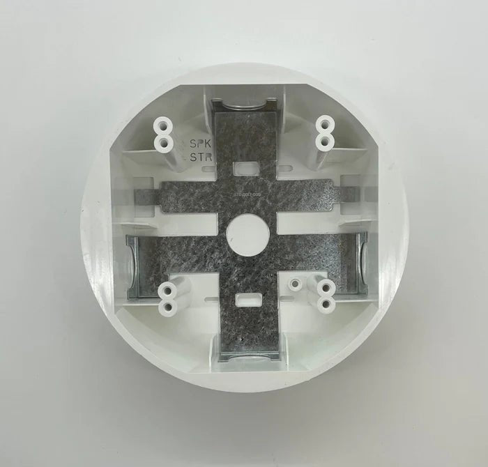 System Sensor SBBCW smoke detector showing its circular design and sensor components for fire safety detection.