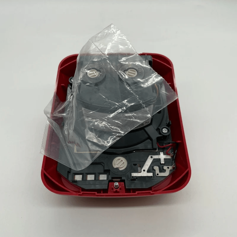 System Sensor SPSRLED fire alarm strobe light with LED lens, mounted on ceiling for emergency alert indication.
