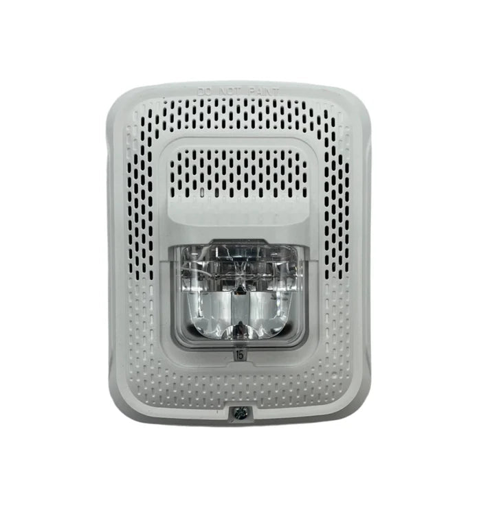 System Sensor SPSWL-P smoke and heat detector with built-in alarm, mounted on ceiling, for fire safety and monitoring.