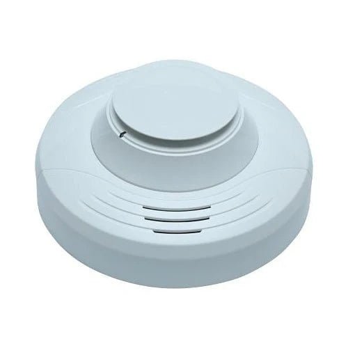System Sensor SS-CO carbon monoxide detector with digital display and alarm, mounted on a wall in a home setting.