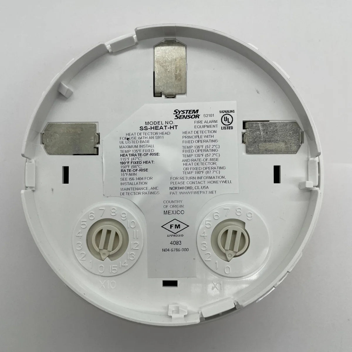System Sensor SS-HEAT-HT heat detector with metal housing and wiring terminals for fire alarm systems.