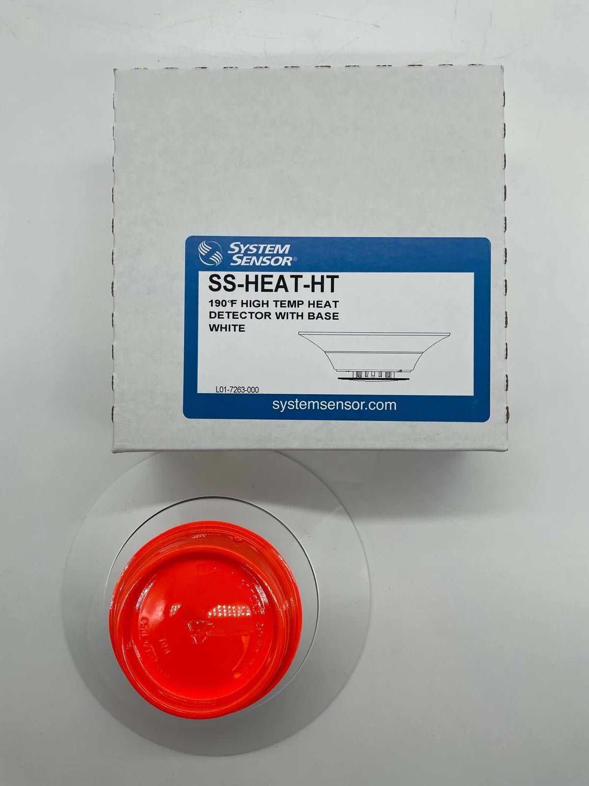 System Sensor SS-HEAT-HT heat detector mounted on ceiling, designed for fire safety and early heat detection in buildings.