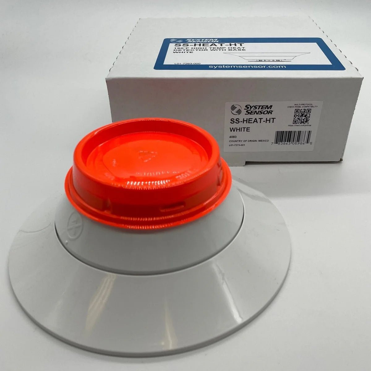 System Sensor SS-HEAT-HT heat detector with mounting base, designed for fire alarm systems, shown in a close-up image.
